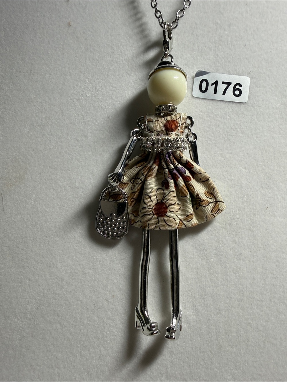 Silver Doll Pendant Necklace with Cream Floral Dress